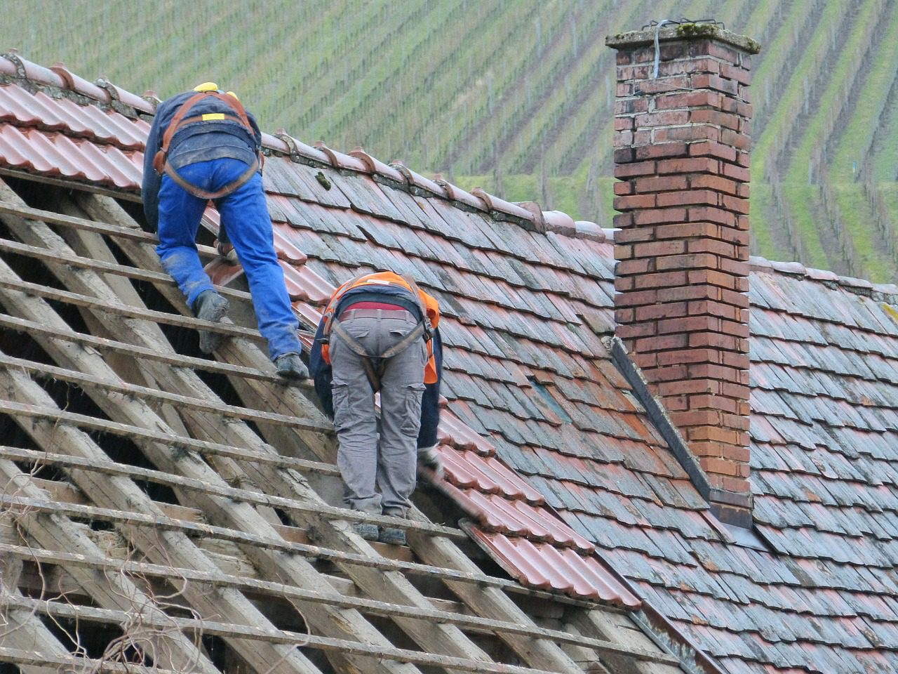 Men Repairing The Roof