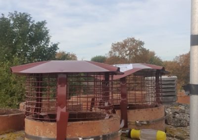 Chimney pots with newly installed protective cowls | Cambridge Roofing Repairs